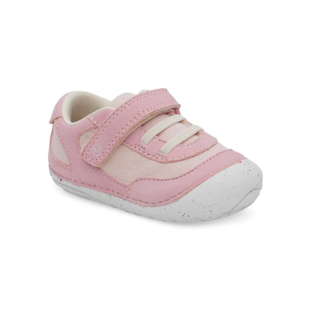 A single Stride Rite SM Sprout Pink toddler shoe with velcro straps, a white toe cap, and made from recycled materials.