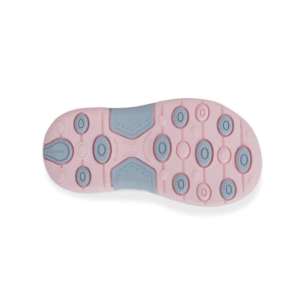 Stride Rite 2.0 Sneaker sole featuring a pink and blue pattern with circular treads and cushioning pads, isolated on a white background.