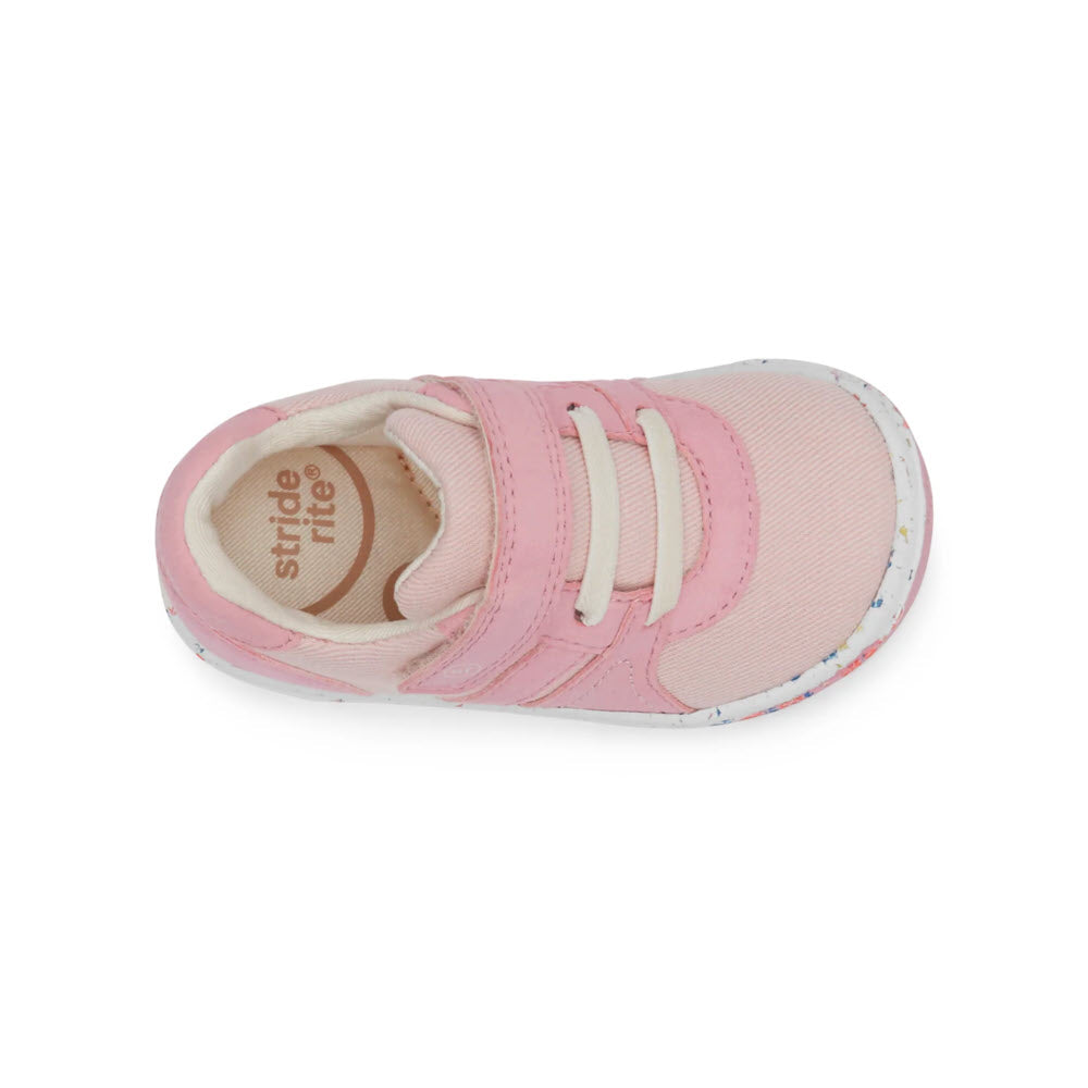 A single pink toddler Stride Rite SR Fern Sneaker with velcro straps and white soles, viewed from above on a white background.