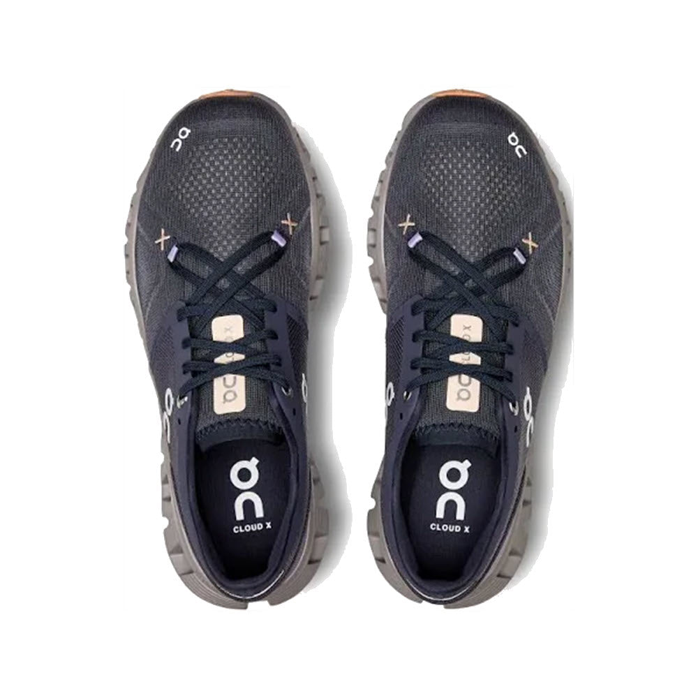A pair of On Running ON CLOUD X 3 IRON/FADE - WOMENS ultralight running shoes with black laces, viewed from above, designed for superior comfort.
