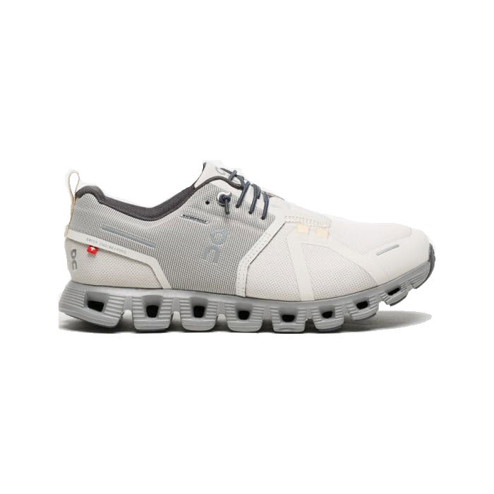 A modern sport sneaker with a white and gray design featuring a unique segmented sole, crafted from sustainable materials by On Running - ON CLOUD 5 WATERPROOF PEARL/FOG - WOMENS.