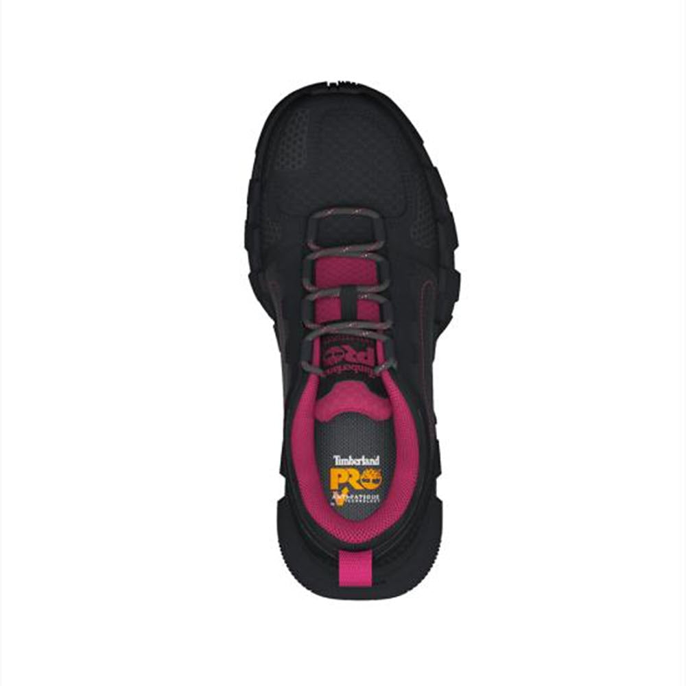 Top view of a pair of black and pink Timberland Composite Toe Powertrain EV work shoes with prominent branding on the insole.