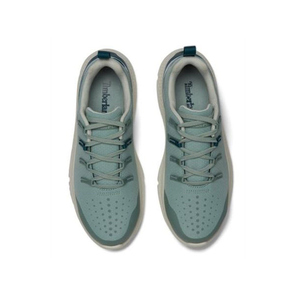 A pair of light blue Timberland Steel Toe Intercept Oxford Sage White sneakers viewed from above on a white background.