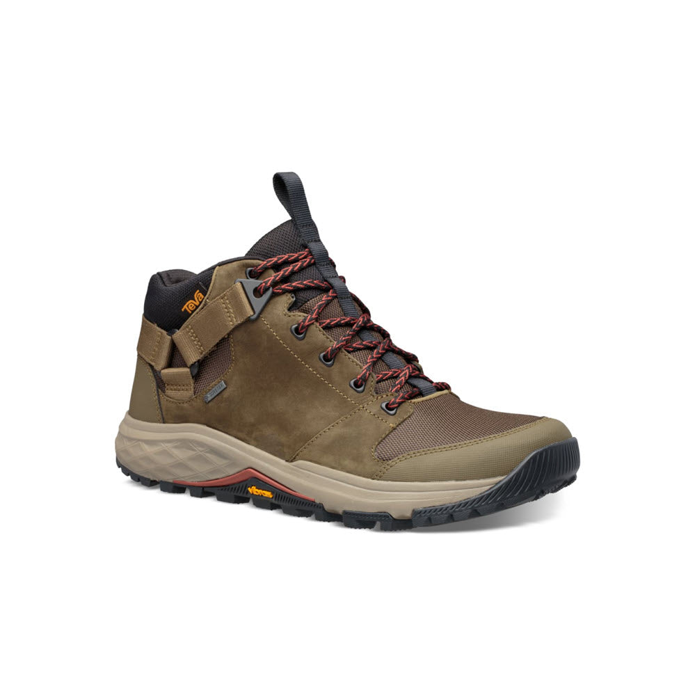 A Teva Grandview GTX Dark Olive men&#39;s hiking boot with red laces, featuring a Vibram Megagrip outsole, isolated on a white background.