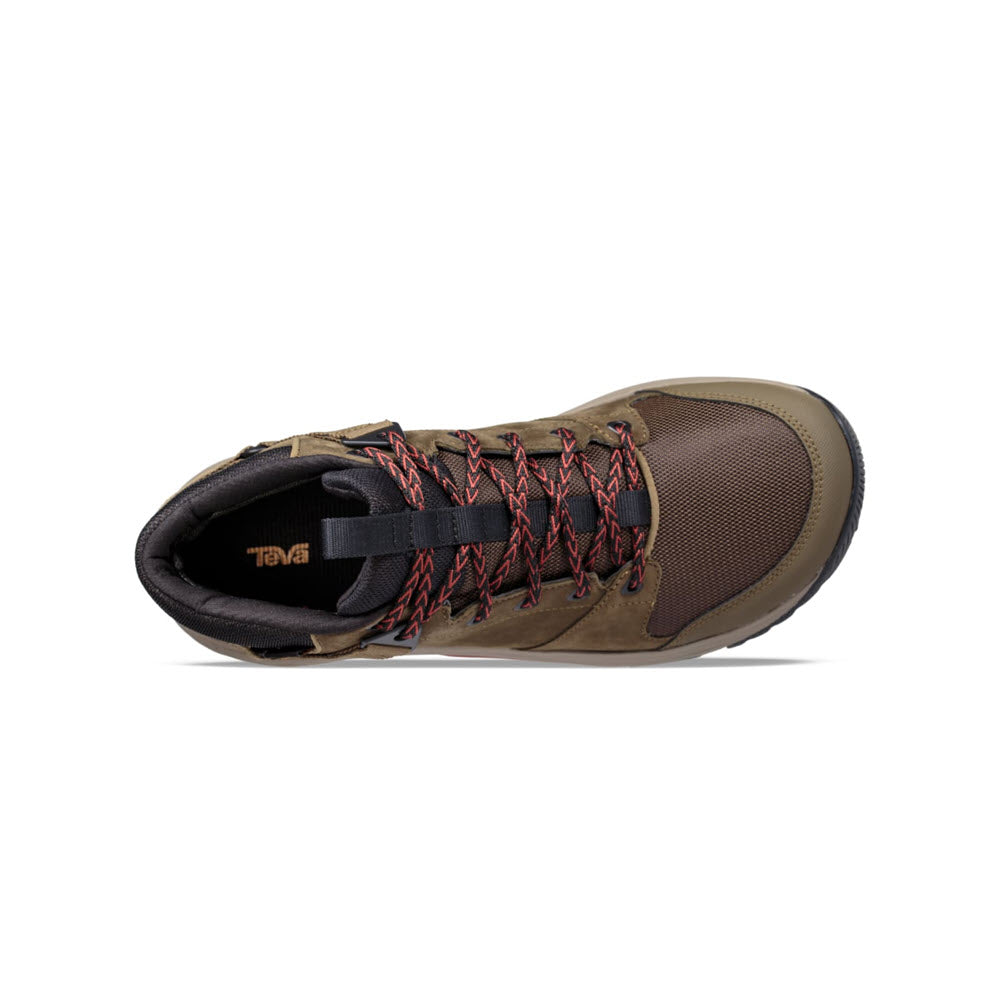 Top view of a single dark olive Teva Grandview GTX hiking boot with red laces and a black Vibram Megagrip outsole on a white background.