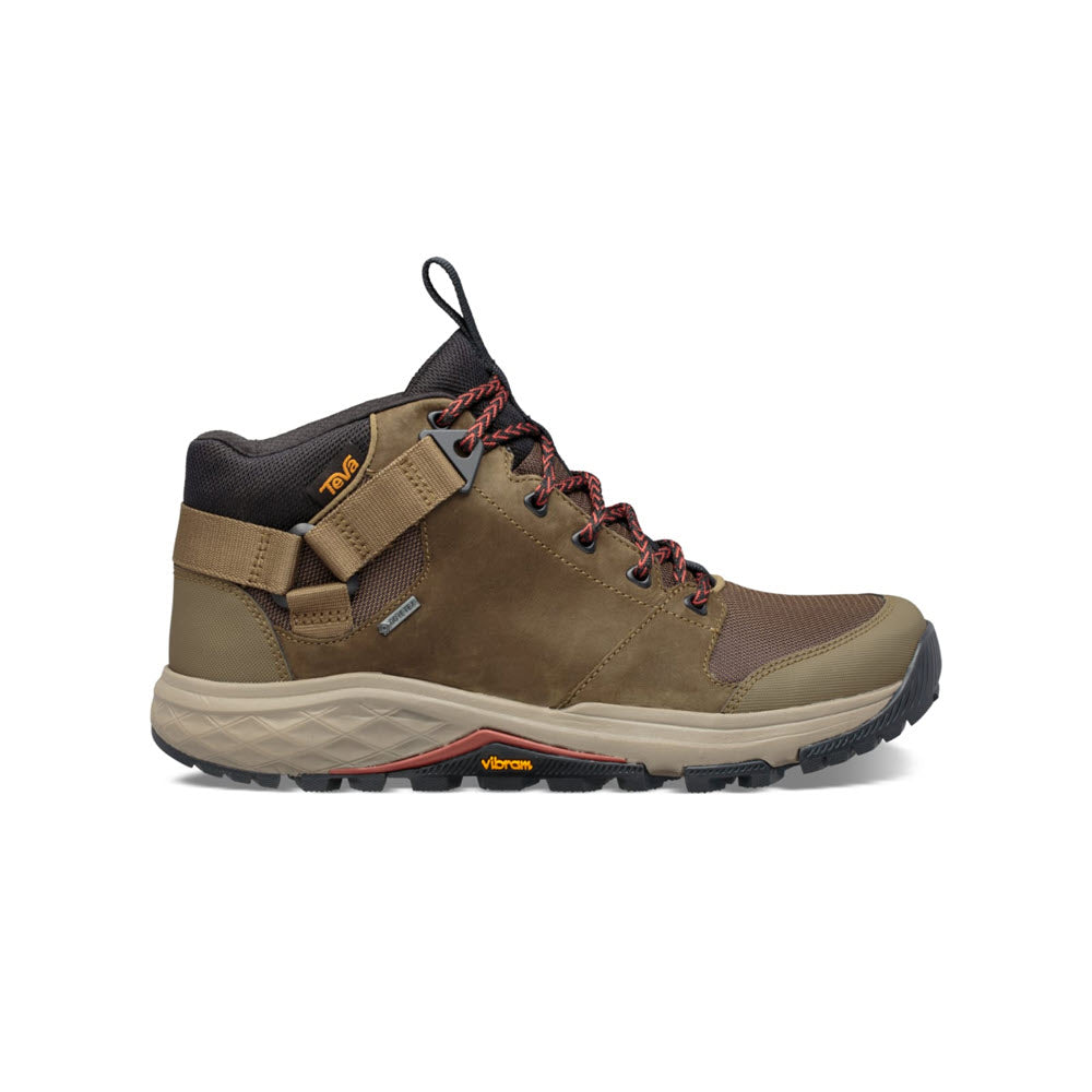 Side view of a brown and black Teva Grandview GTX hiking boot with red laces and a Vibram Megagrip outsole on a white background.