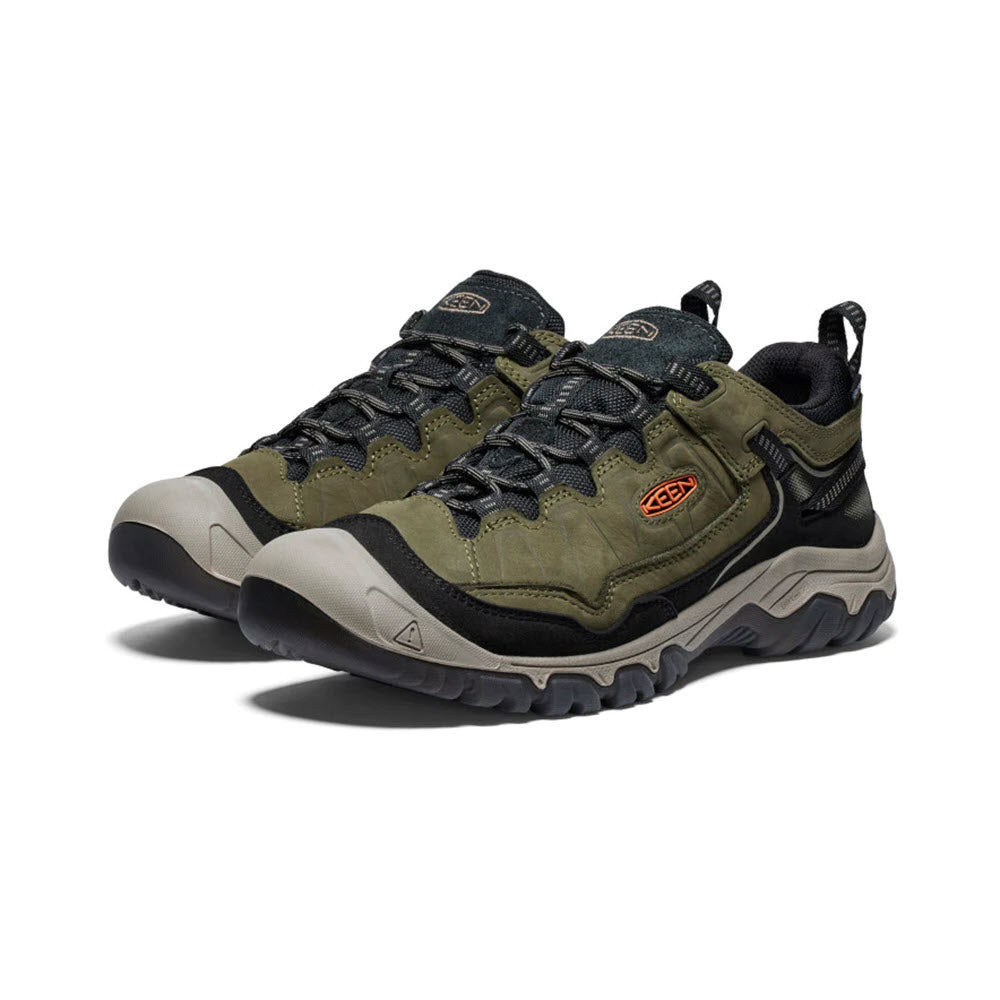 A pair of Keen Targhee IV WP Dark Olive/Gold Flame hiking shoes with rubber soles and lace-up fronts, displayed against a white background.