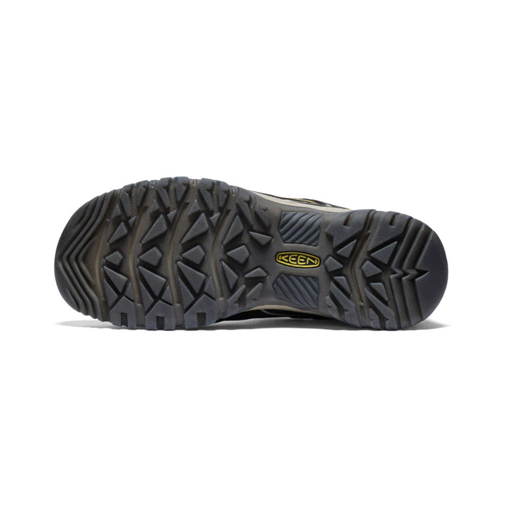 Sole of a gray durable Keen Targhee IV WP Dark Olive/Gold Flame - Mens hiking shoe displaying its rugged tread pattern and branding.