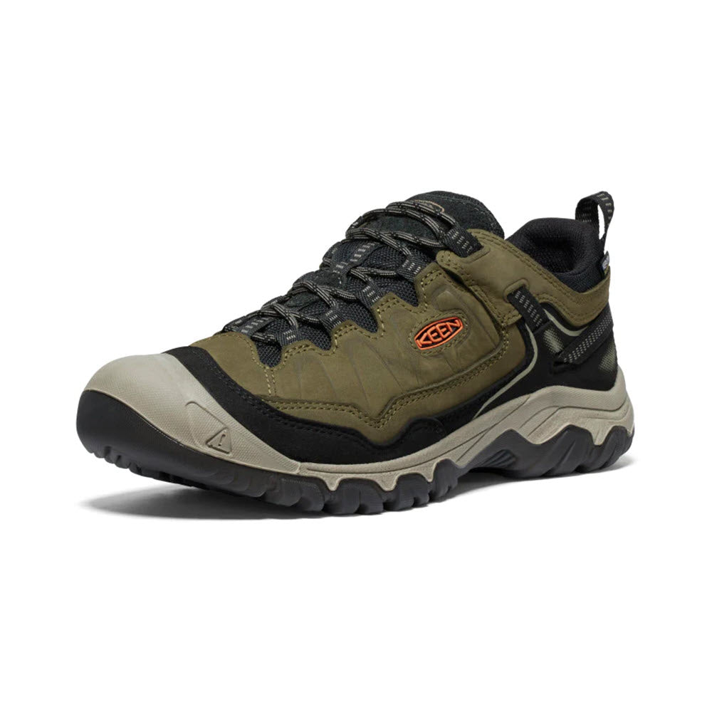 A single hiking shoe featuring a green and beige color scheme with rugged tread and a black Keen logo on the side, using durable Targhee materials.