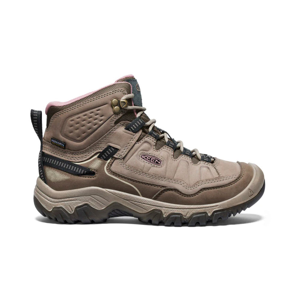 A single KEEN TARGHEE IV MID WP BRINDLE/NOSTALGIA ROSE - WOMENS hiking boot with black laces and a rugged sole on a white background.