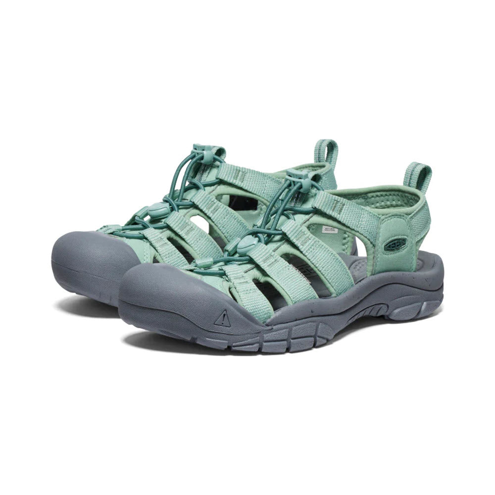A pair of Keen Newport H2 Granite Green women&#39;s hybrid sports sandals with adjustable straps and a sturdy sole, displayed on a white background.