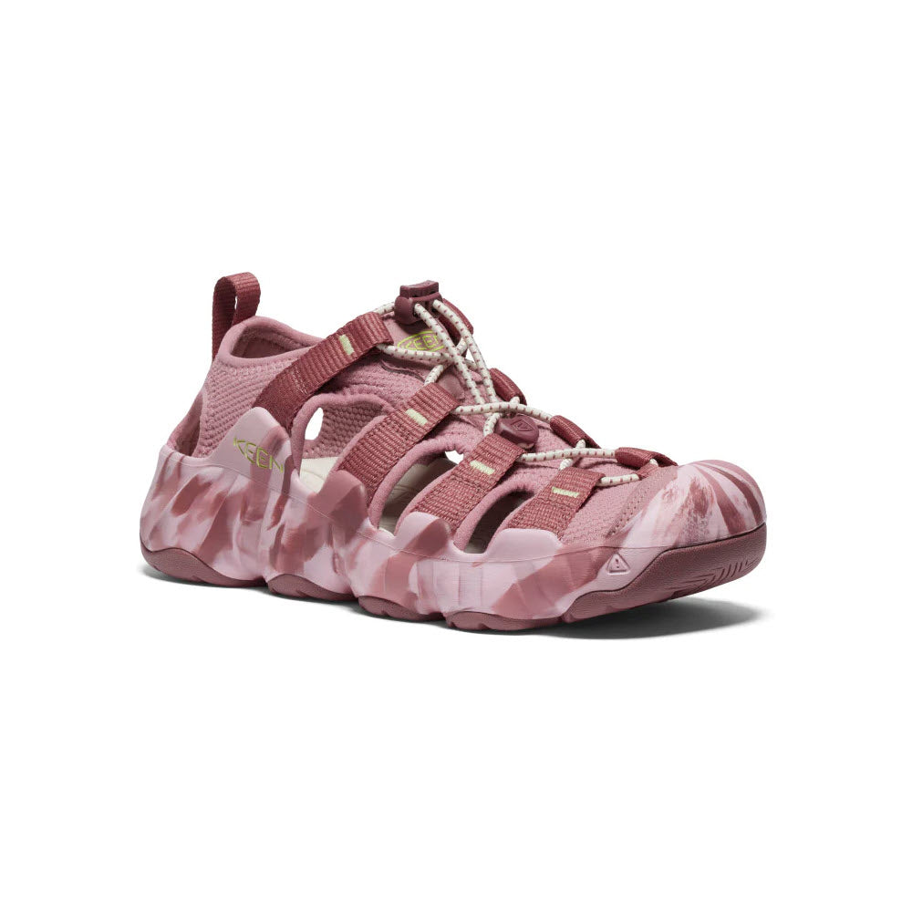A pink Keen Hyperport H2 Nostalgia Rose hiking sandal with a closed toe design, featuring maximal cushioning and a camouflage sole, displayed on a white background.