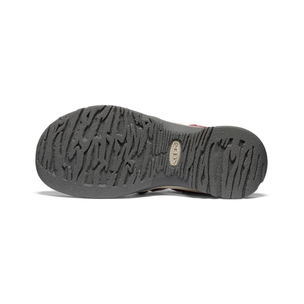 Bottom view of a water-ready sandal featuring a textured gray sole with the Keen logo in the center.