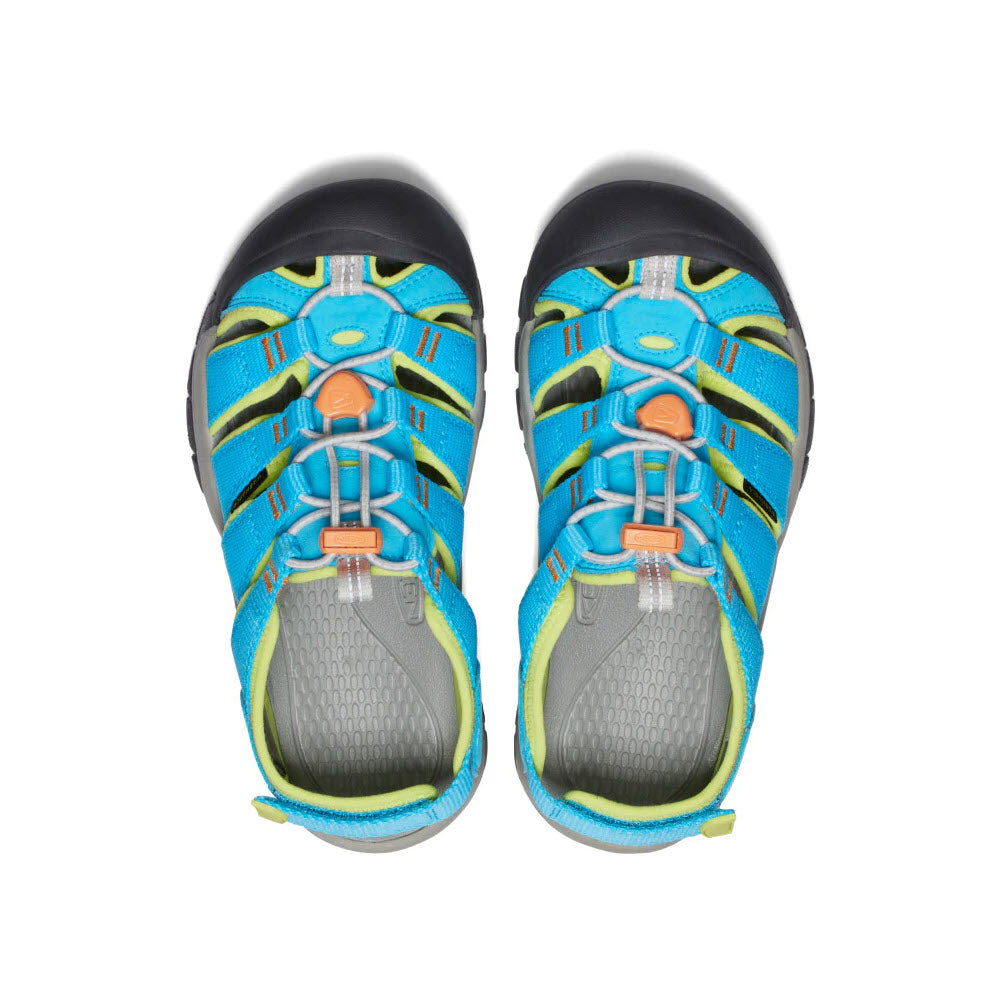 A pair of Keen Newport Boundless Youth Blue Atoll - Kids adventure sandals with blue and green straps, and adjustable orange closures, viewed from above on a white background.