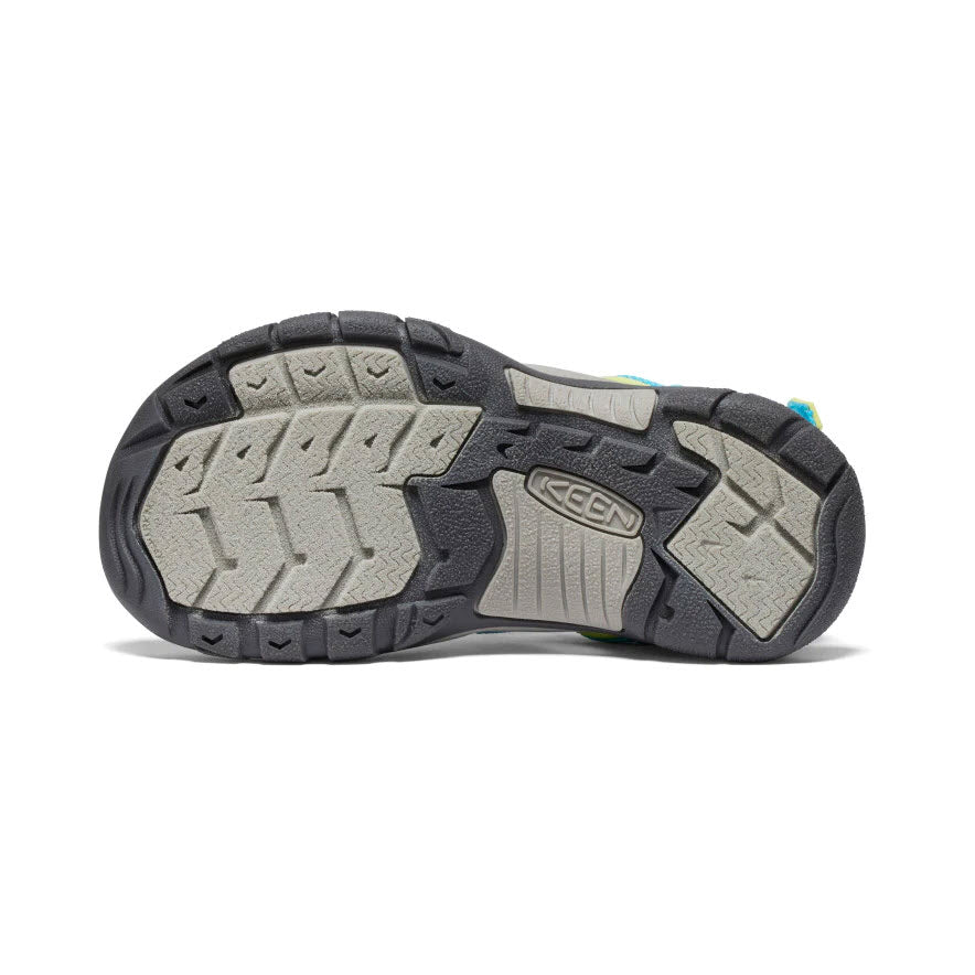 Sole of a kids&#39; adventure sandal with detailed tread pattern and visible brand logo Keen Newport Boundless Youth Blue Atoll - Kids.