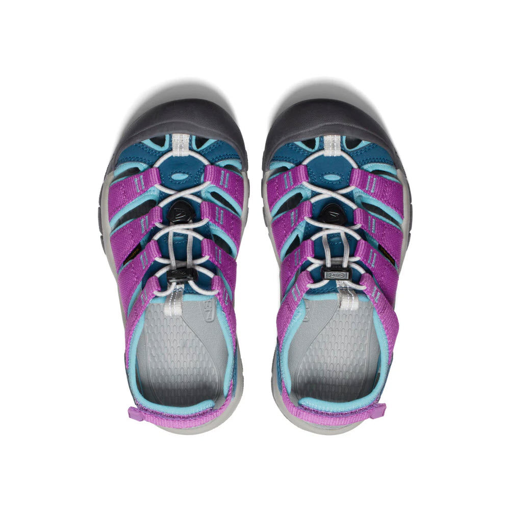 Top view of a pair of Keen Newport Boundless Youth Legion Blue kids&#39; adventure sandals with adjustable heel straps on a white background.