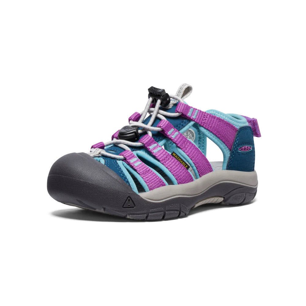 A colorful Keen kids&#39; adventure sandal featuring blue, purple, and pink straps, a grey toe cap, and a black sole, with an adjustable heel strap on a white background.