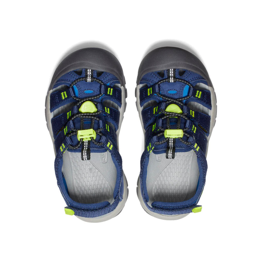 A pair of Keen Newport Boundless Child Naval Academy Kids hiking shoes with neon green accents, featuring an adjustable heel strap, viewed from above, on a white background.