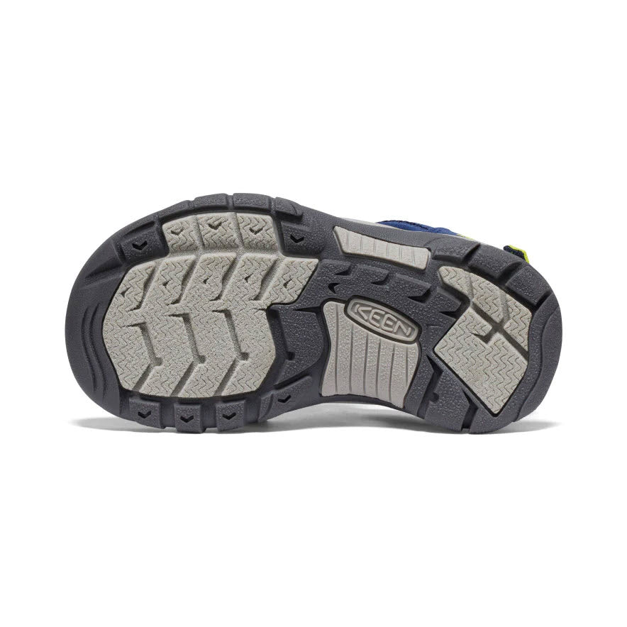 Bottom view of a Keen hiking shoe showcasing its gray and black rugged outsole with Keen logo and adjustable heel strap.