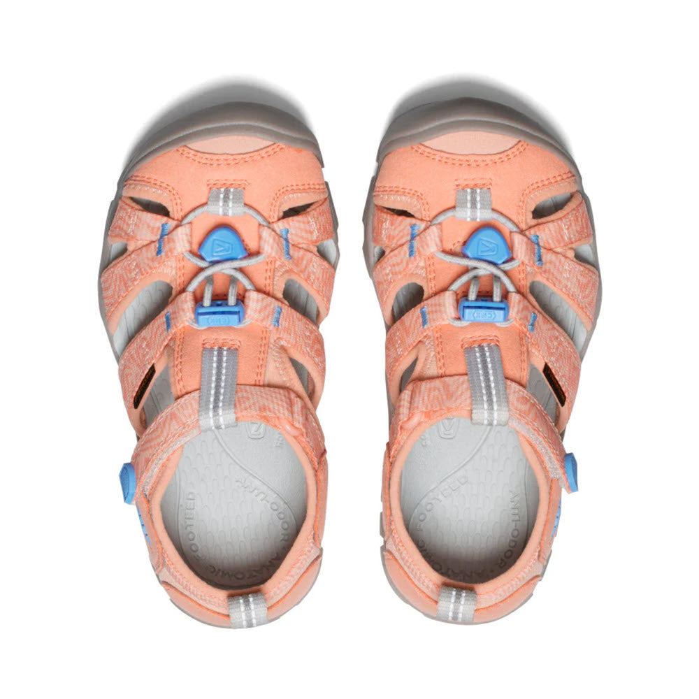 Top view of a pair of Keen Seacamp II CNX Child Papaya Punch water sandals for kids, isolated on a white background.
