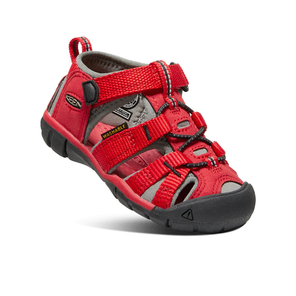 A single red Keen Seacamp II CNX Racing Red toddler water sandal featuring adjustable straps and a closed toe design, displayed on a white background.