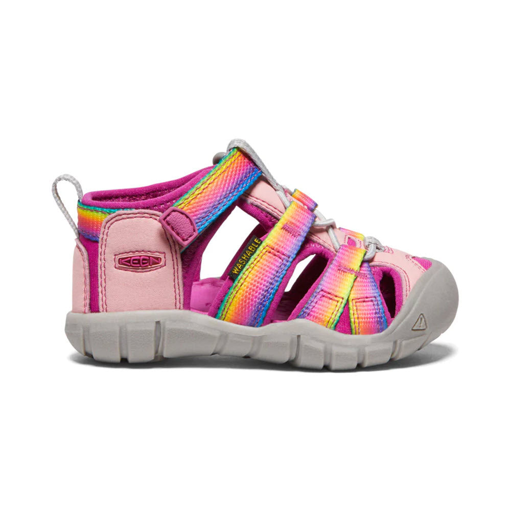 Child&#39;s colorful Keen Seacamp II CNX Tots Rainbow hybrid water sandal with pink base and multicolored straps on a white background.