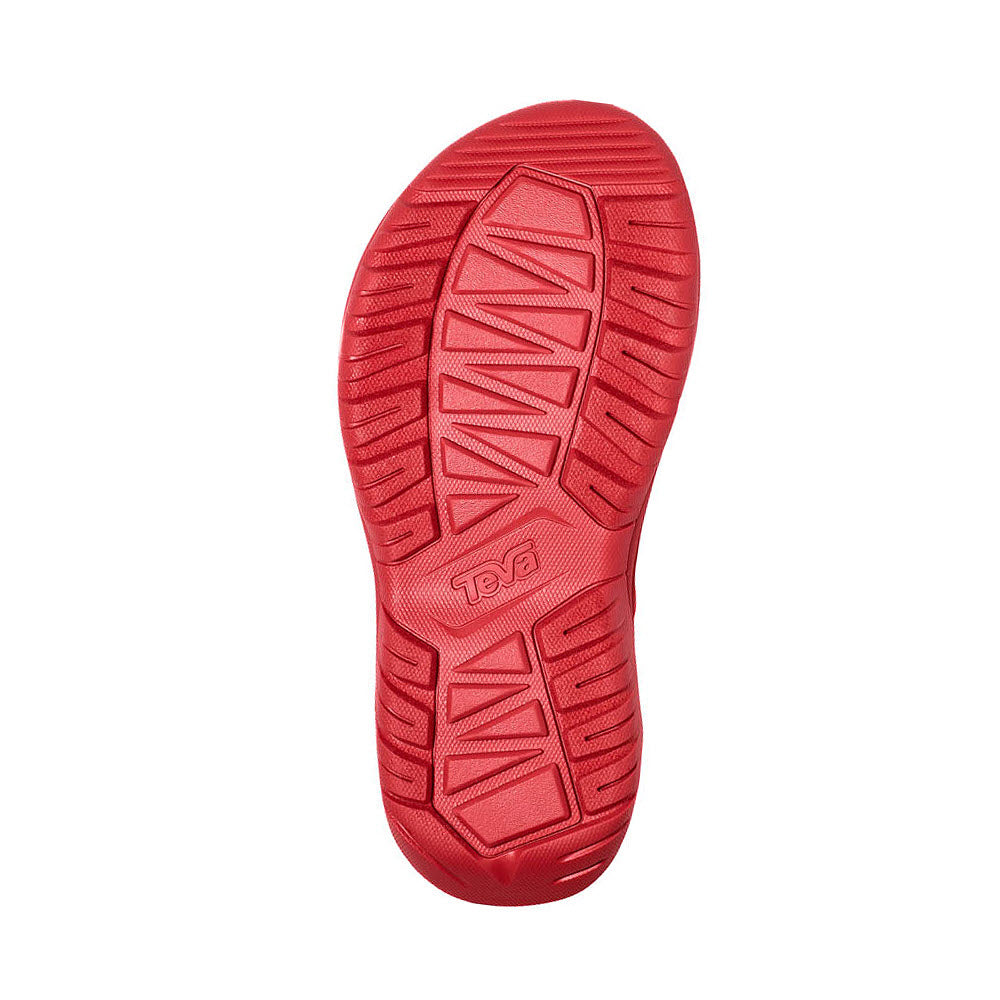 Red sandal sole displaying a textured pattern and Teva logo, photographed against a white background, characteristic of the Teva Hurricane XLT2 Sandal.