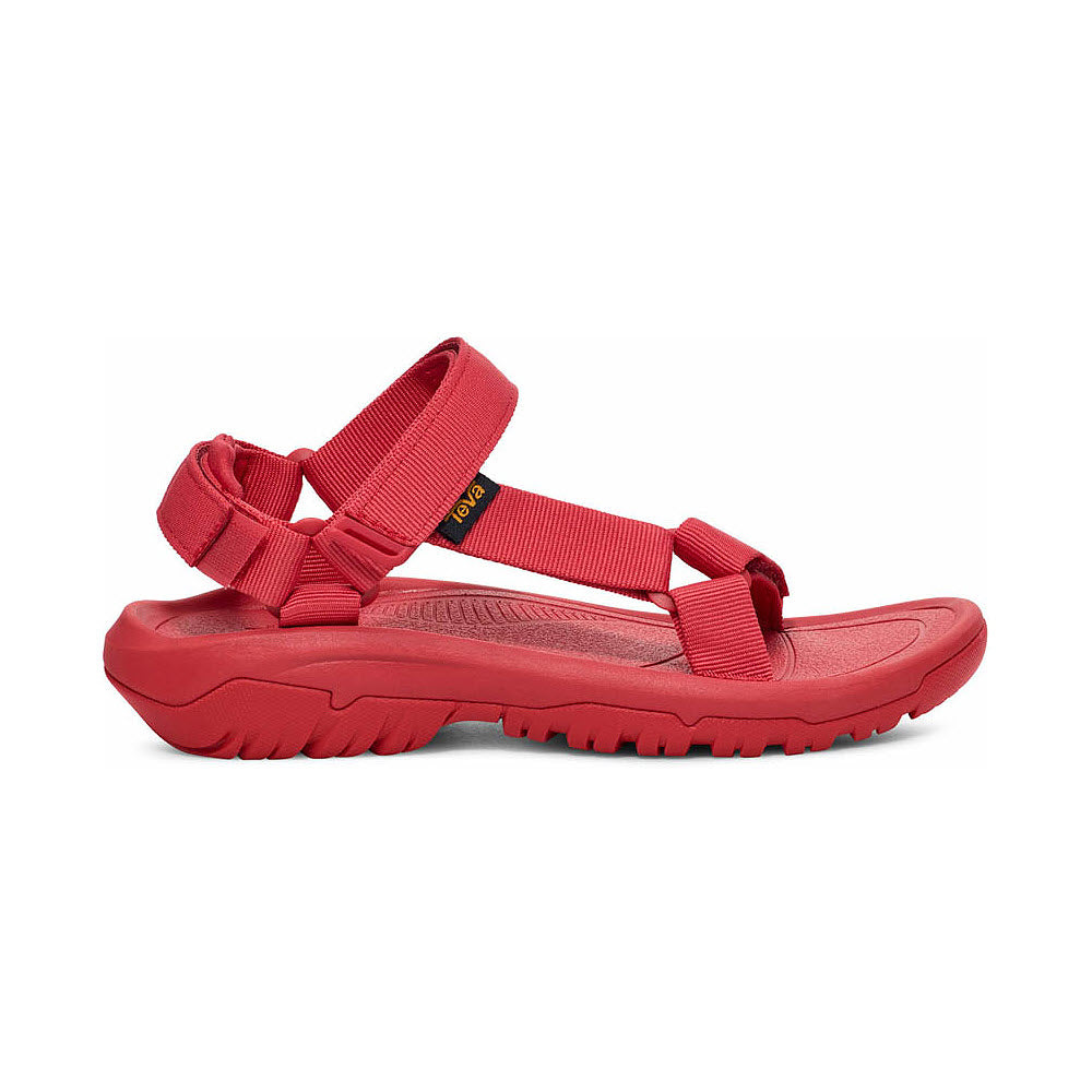 Red Teva Hurricane XLT2 Sandal with adjustable straps and a thick, sturdy sole, displayed against a white background.