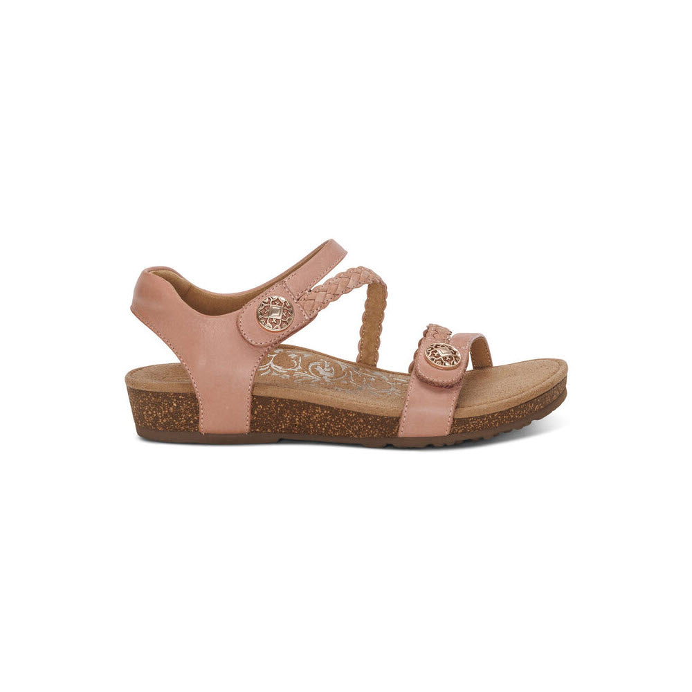 A single pink quarter strap sandal with a cork sole, featuring an adjustable strap with the Aetrex logo, displayed against a white background.