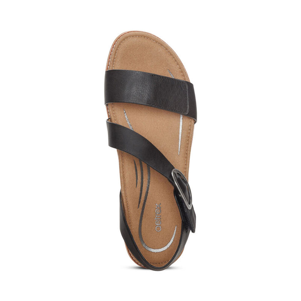 A single AETREX TAMARA BLACK - WOMENS slide sandal featuring a genuine leather upper with a cross strap design, displayed against a white background.