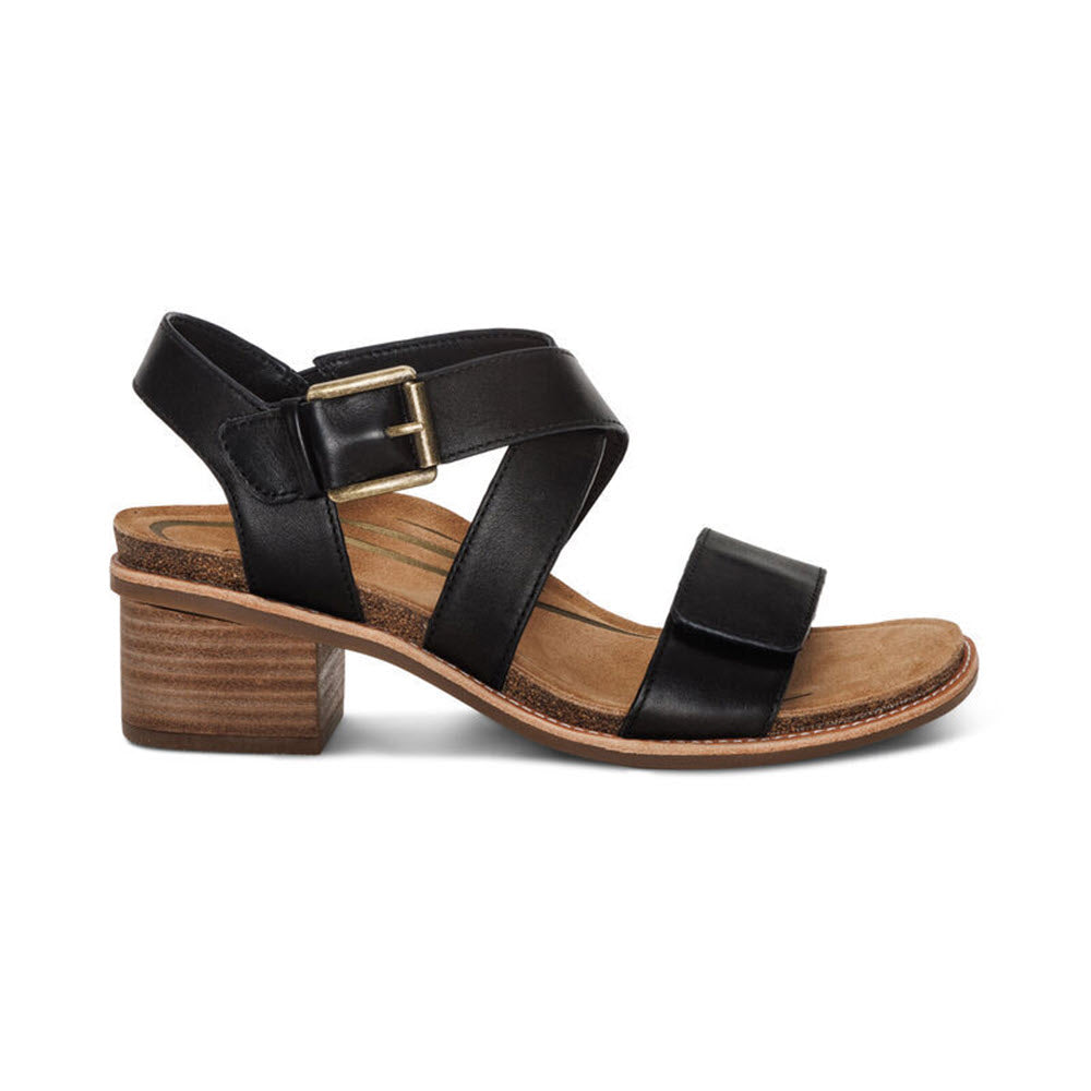 Aetrex Kristin Black strappy sandal with a chunky wooden heel and an adjustable hook and loop closure, isolated on a white background.