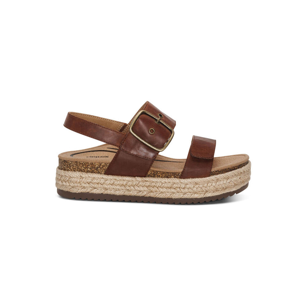 A Aetrex VANIA WALNUT - WOMENS sandal with a thick, espadrille-style sole and a buckle strap, isolated on a white background.