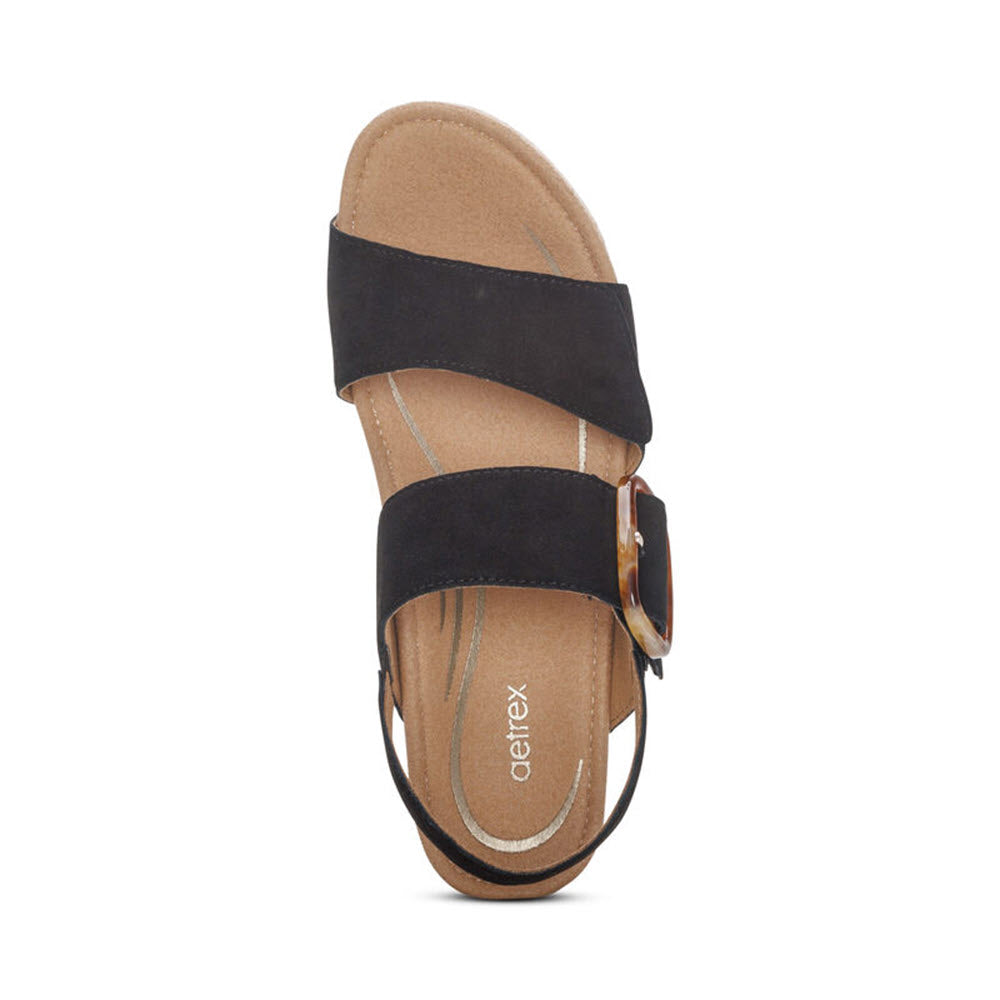 A AETREX ASHLEY BLACK - WOMENS strappy sandal with a buckle and a memory foam footbed, displayed against a white background.