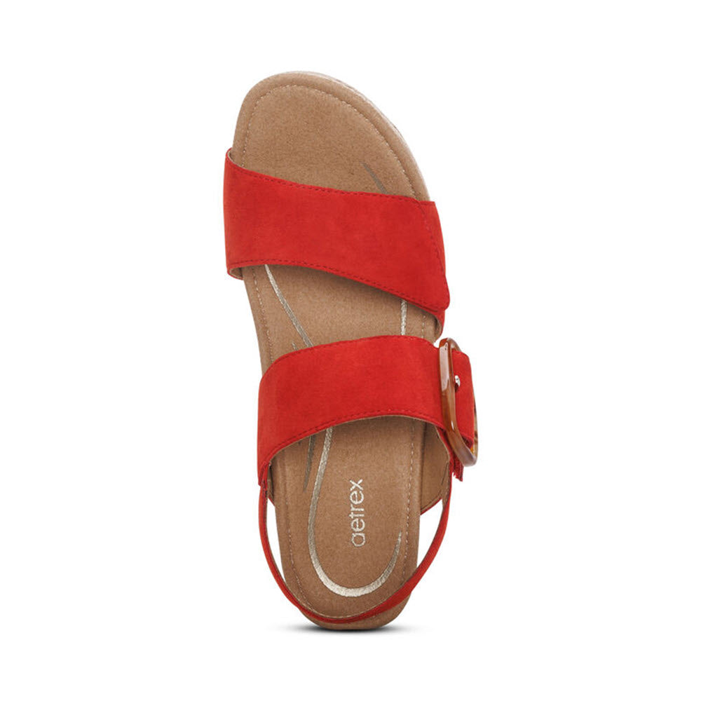 Aetrex Ashley Poppy - Women&#39;s red suede flat sandal with a memory foam footbed and a buckle strap over the ankle and a wide toe strap, displayed against a white background.