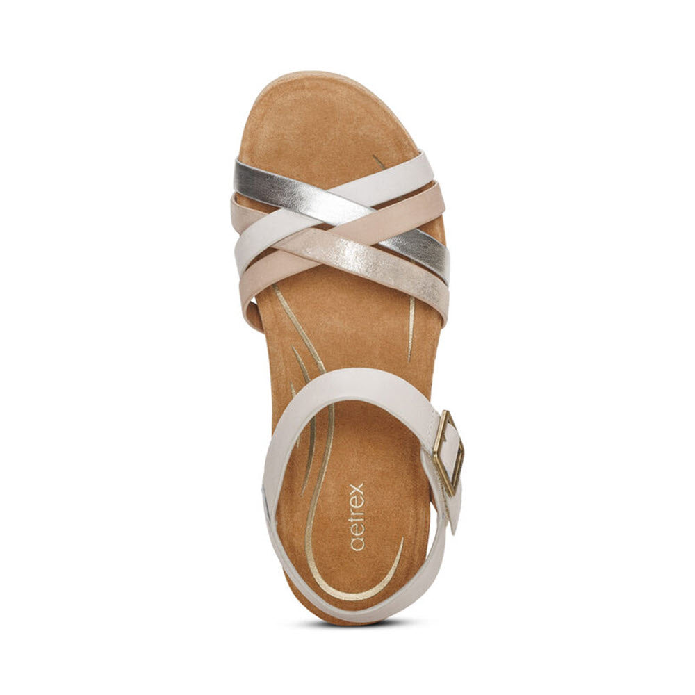 Silver and white AETREX NOELLE IVORY - WOMENS strappy sandal with an adjustable hook &amp; loop closure, viewed from above against a white background.