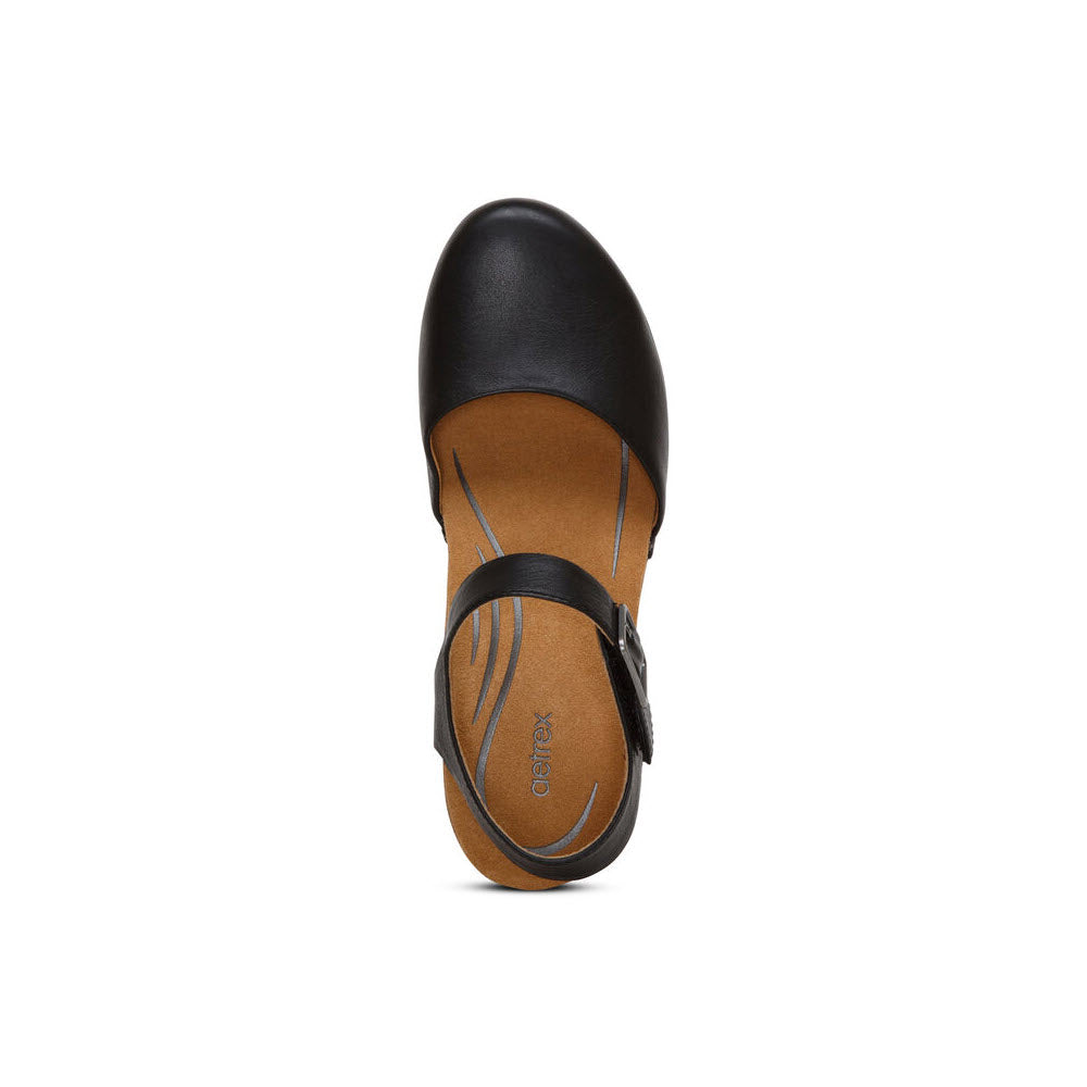 Top view of an Aetrex Finley Black - Womens single-strap women&#39;s flat shoe with a round toe and tan insole featuring arch support, isolated on a white background.