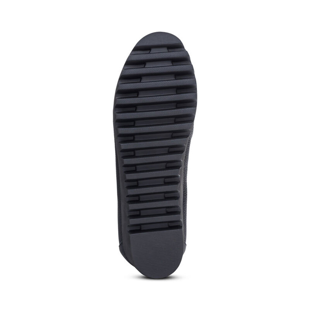 Bottom view of the Aetrex Brianna Black - Womens shoe showcasing a dark treaded sole with horizontal and vertical grooves and memory foam for grip.