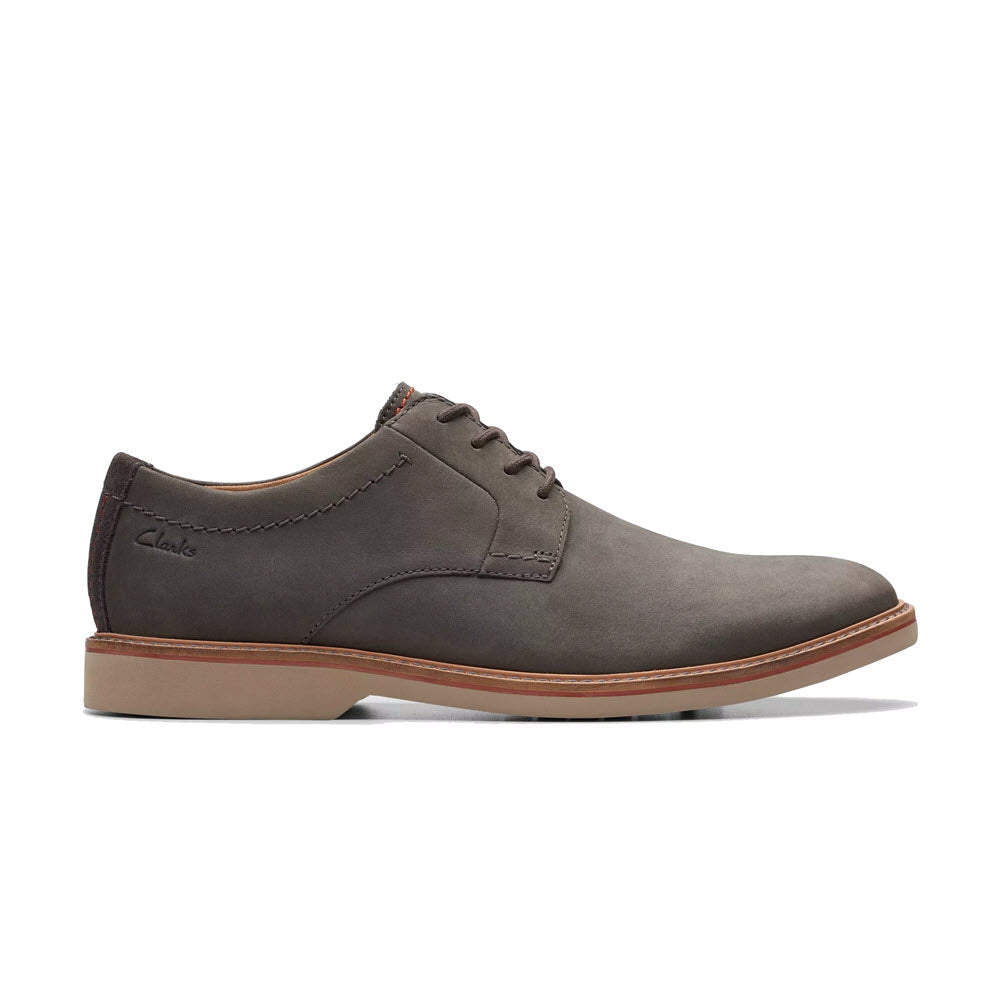 A single CLARKS ATTICUS LT LACE OXFORD GREY NUBUCK men&#39;s dress shoe with laces, featuring a smooth finish and a contrasting tan sole.