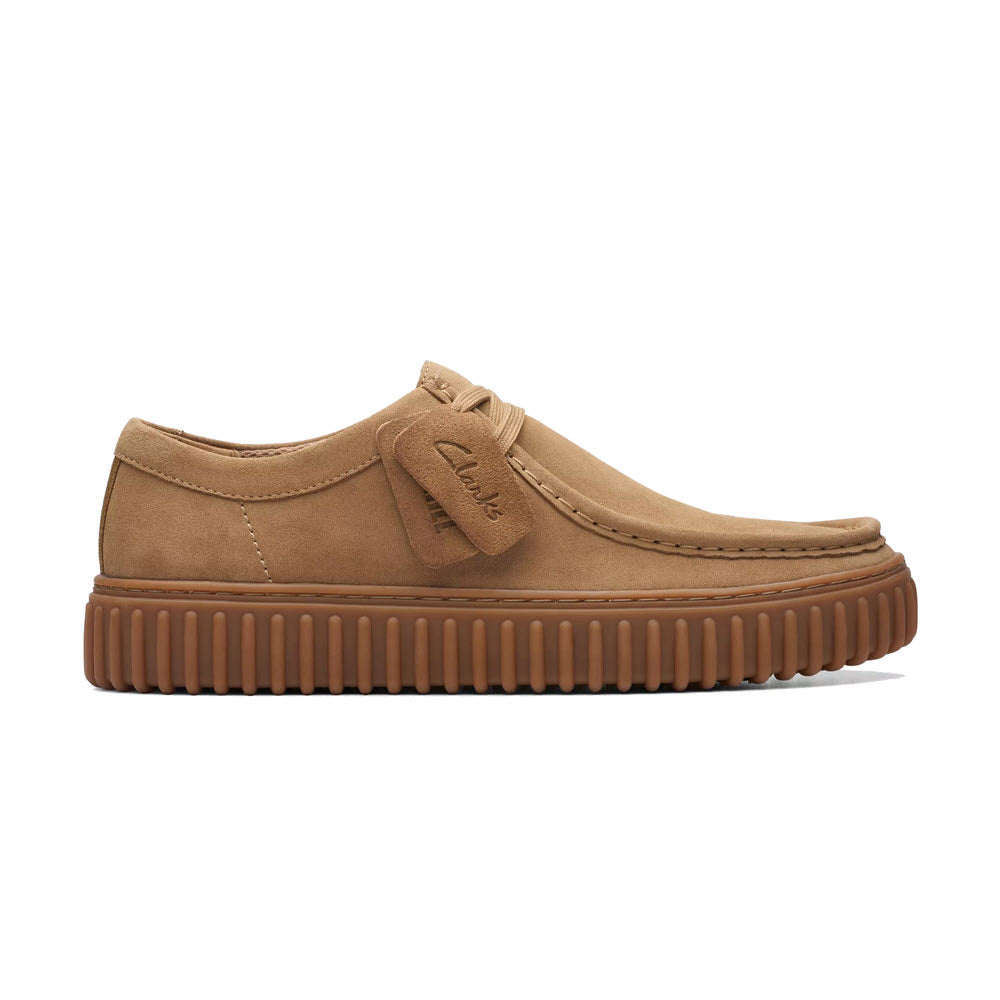 Tan suede Clarks Torhill Low Oxford shoe with a thick ribbed outsole and an embossed logo on the side.