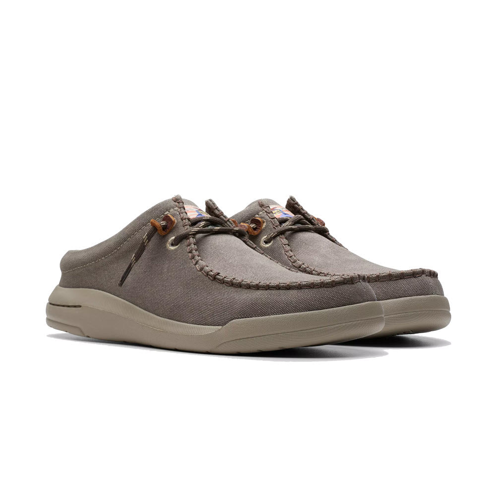 A single Clarks Driftlite Surf slip on moc toe taupe interest boat shoe with brown laces and an EVA outsole, displayed against a white background.