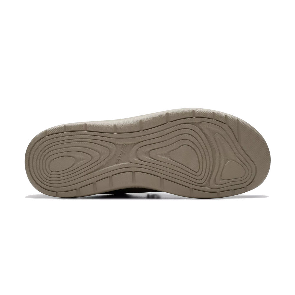 Bottom view of a single Clarks Driftlite Surf Slip On Moc Toe Taupe Interest - Mens sneaker, showcasing its textured EVA outsole with wave-like patterns.