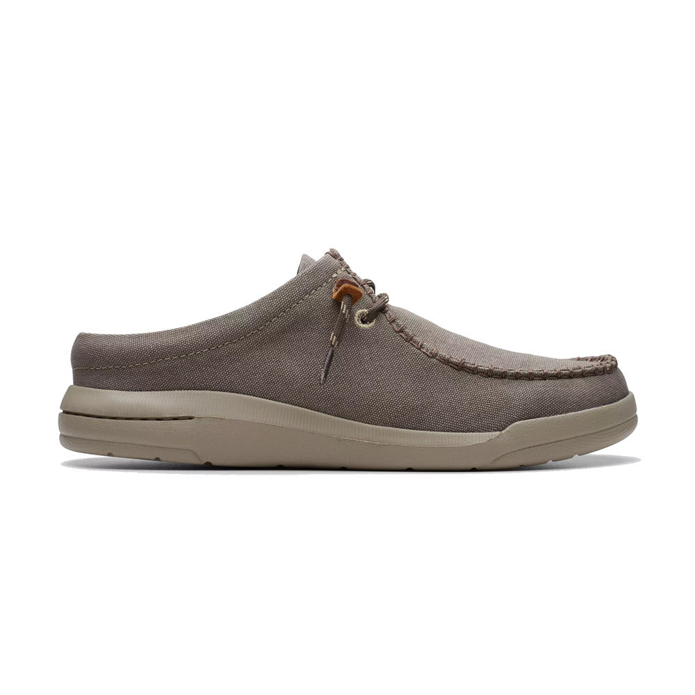 Casual men's slip-on shoe with lace detail, featuring a gray canvas upper and a light beige EVA outsole, isolated on a white background - Clarks Driftlite Surf Slip On Moc Toe Taupe Interest.