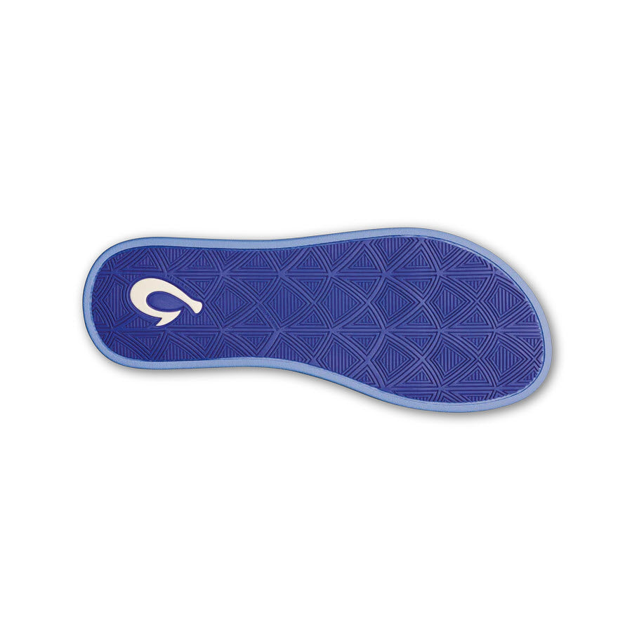 Olukai Puawe Cloud Blue Floral shoe sole with a geometric pattern and a white crescent moon logo on the heel area, isolated on a white background. Perfect as water-friendly footwear.