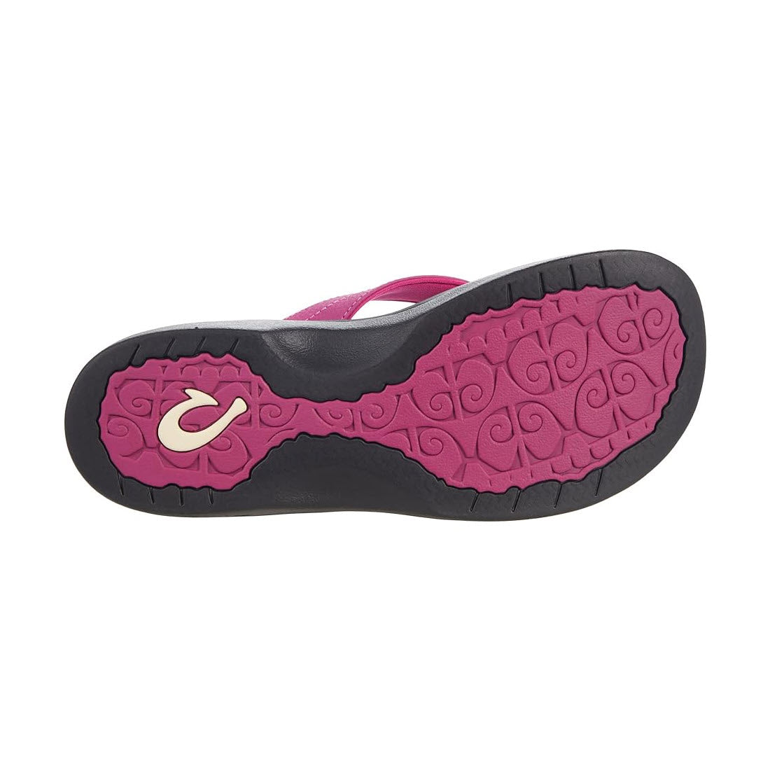 Bottom view of an Olukai Ohana Orchid Flower - Womens shoe showing its pink textured sole with a circular Olukai logo design, ideal for a water-resistant sandal.
