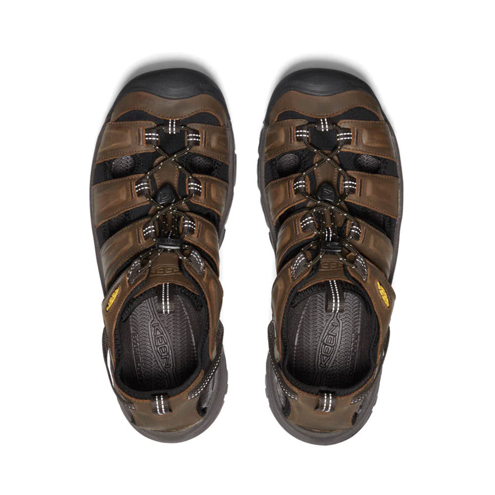 Top view of a pair of brown Keen KEEN TARGHEE III SANDAL BISON MULCH - MENS hiking sandals with black and gray accents, displayed on a white background.