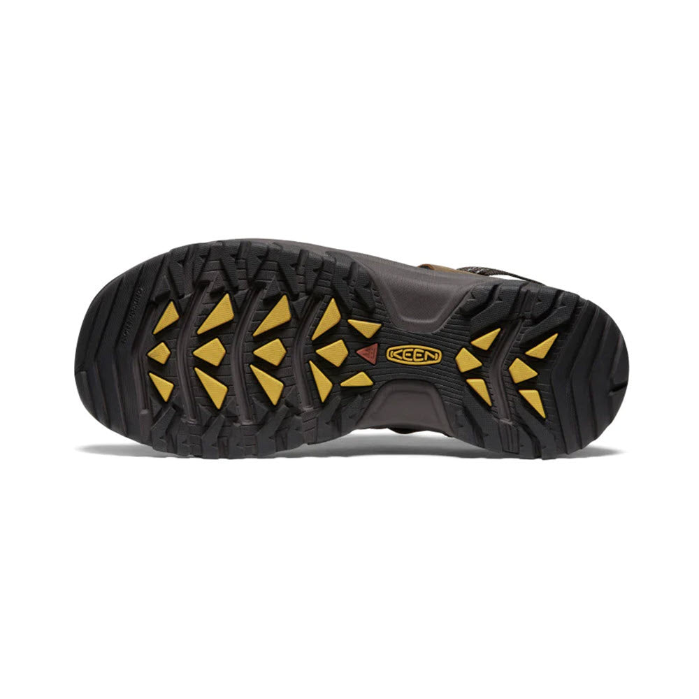 Bottom view of a rugged hiking shoe showing a black sole with a distinctive yellow and black tread pattern and the Keen Targhee III logo.