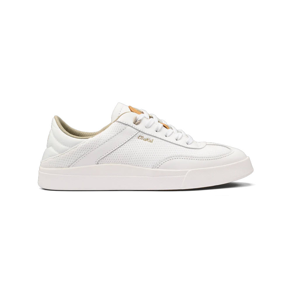 A white low-top court sneaker with lace-up closure and a tan accent on the label at the tongue. Try the Olukai Kilea White - Womens.