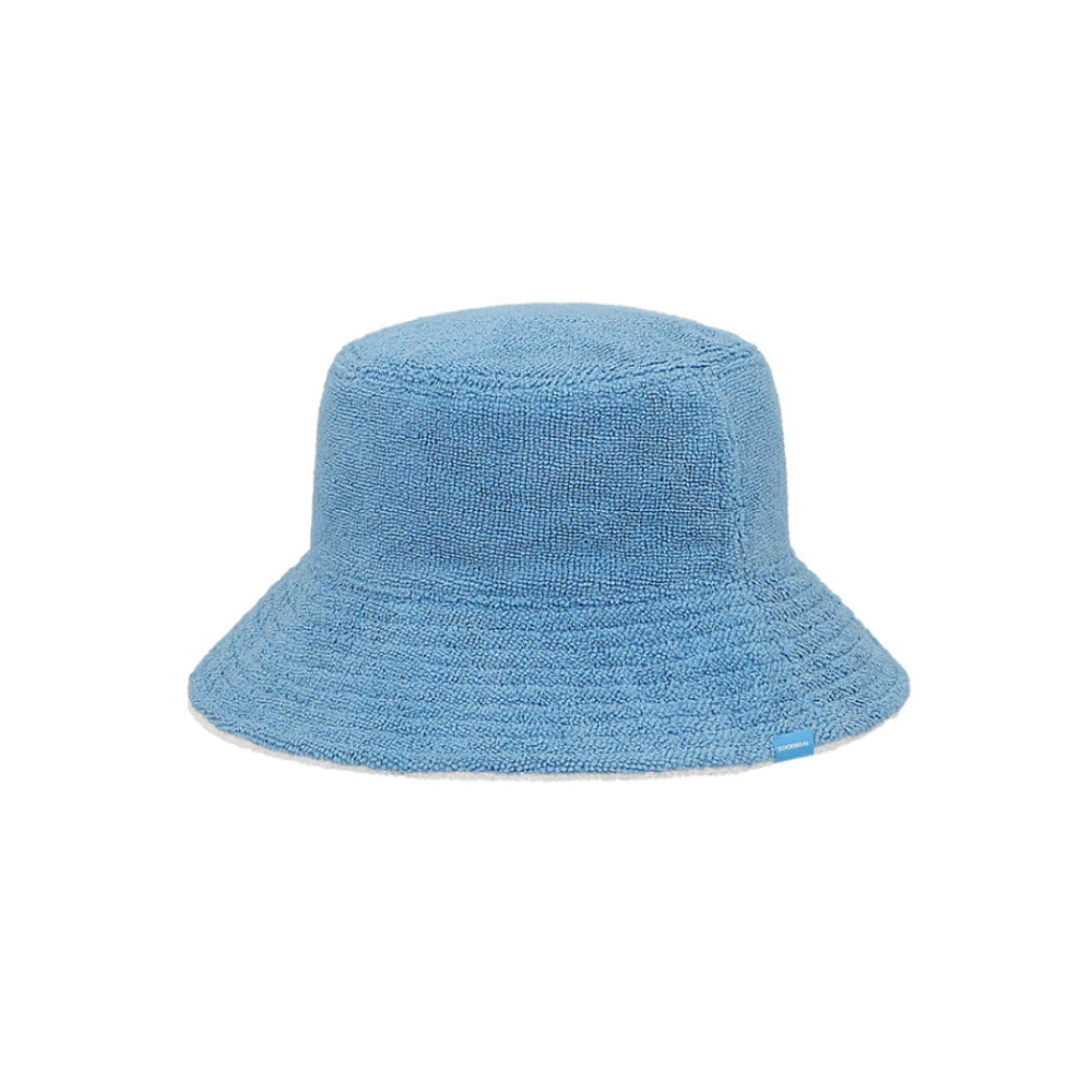 A Kooringal Beachie Bucket Blue hat made from a textured, UPF50+ sun protection fabric, displayed against a plain white background.