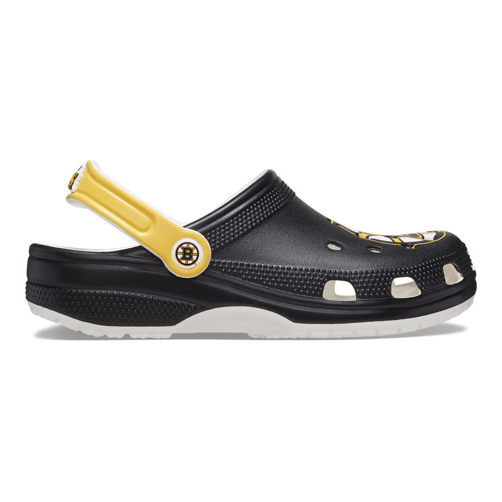 A single Crocs Boston Bruins Classic Clog White - Mens with a yellow strap, white ventilation holes, and a circular logo on the strap, embodying iconic Crocs comfort, isolated on a white background.