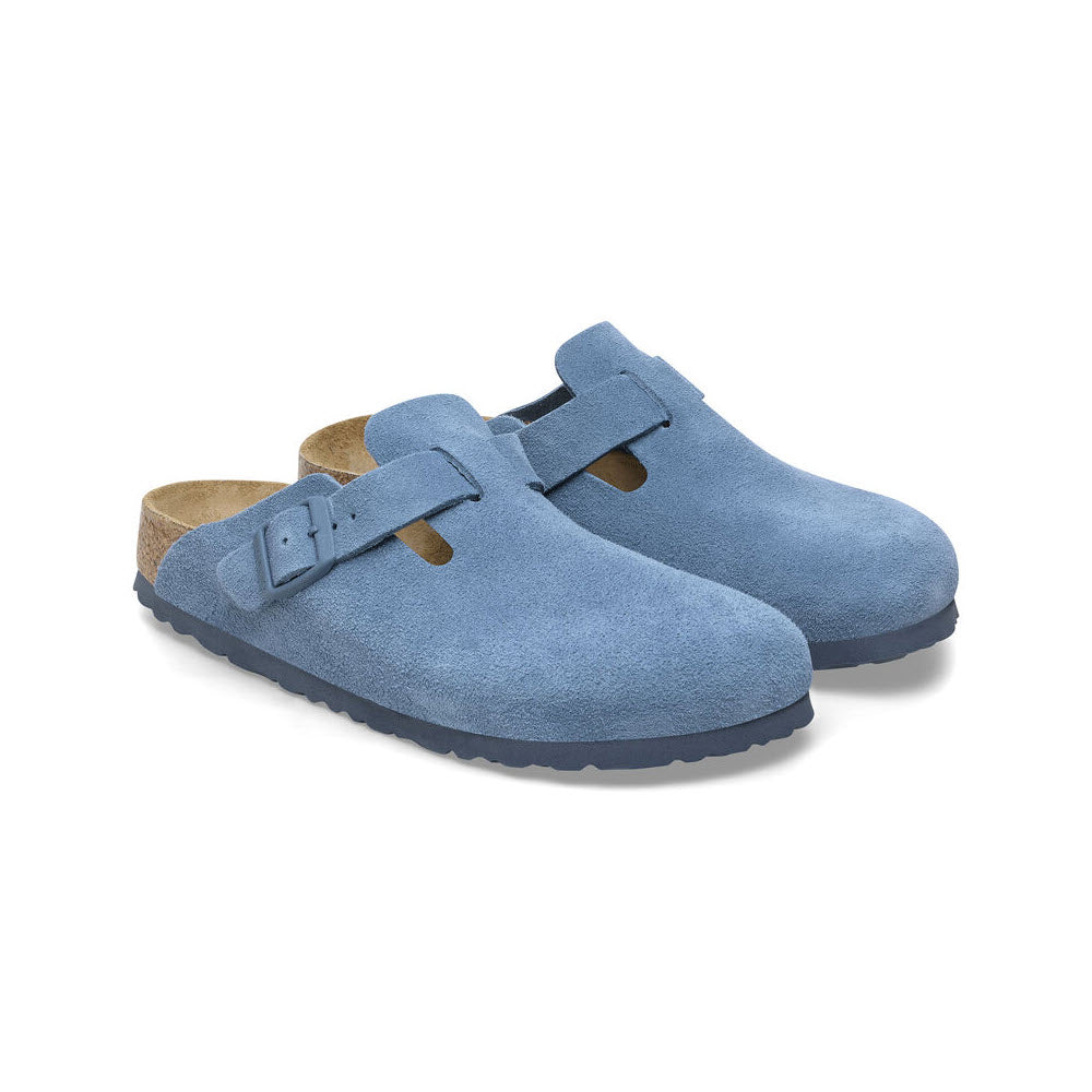 A pair of Birkenstock Boston Elemental Blue - Womens clogs with adjustable buckles and a soft footbed, displayed against a plain white background.